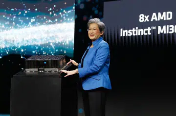 Dr Lisa Su with the MI300X GPU platform. Photo Credit: AMD