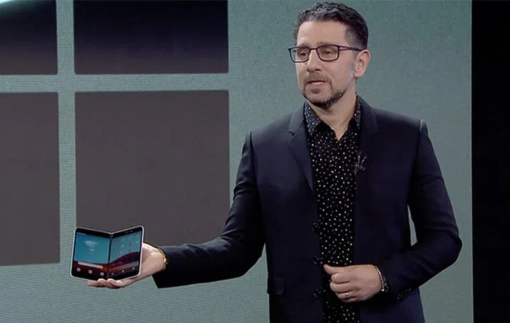 Microsoft's chief product officer Panos Panay holding the Surface Duo.