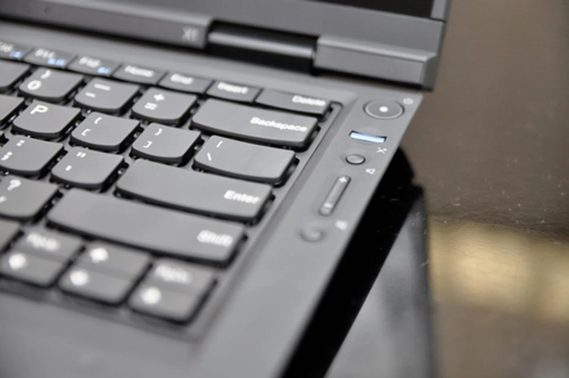 Controls have been moved to the side to give the keyboard and trackpad some space.