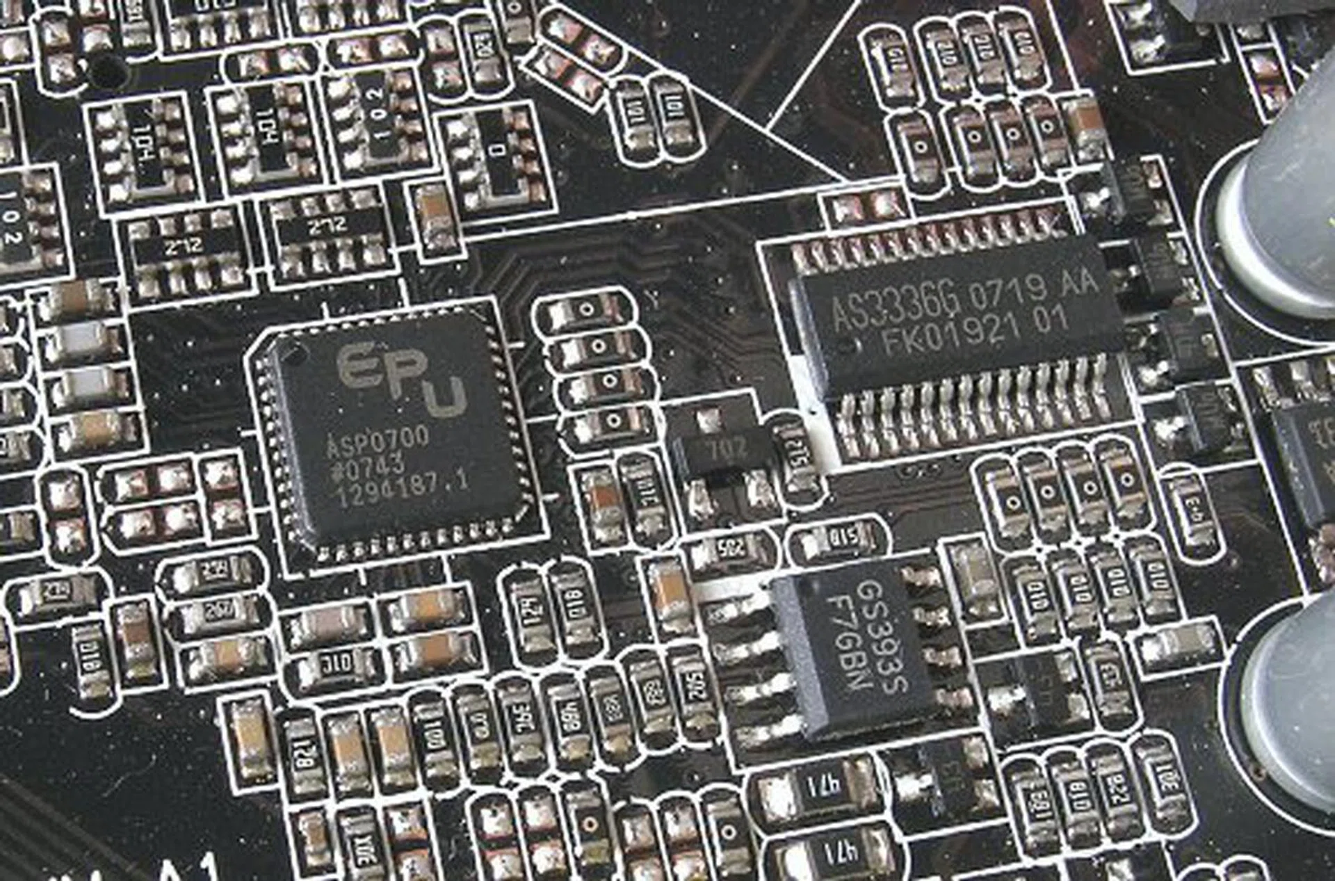 the ASP0700 is ASUS' own Vcore regulator that powers their EPU engine. The AS3336G is also an ASUS IC to augment its 8-phase PWM.