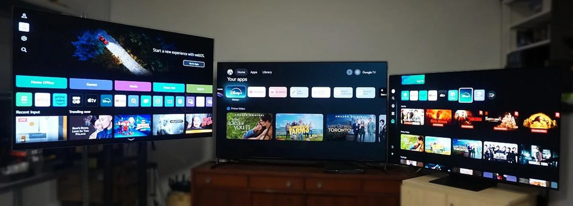 From left to right: LG G4, Sony A95L, and Samsung S95D. What you see on the LG is just the tip of the iceberg. There's much more crammed on the home screen when you scroll below. By contrast, Sony had the most straightforward and least cluttered screen to navigate and get to what you need to do most often.