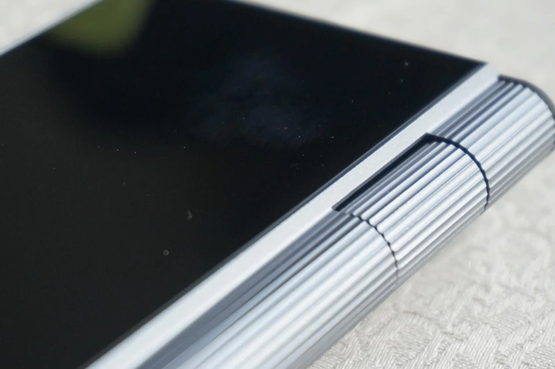 Volume control is via this roll wheel. 