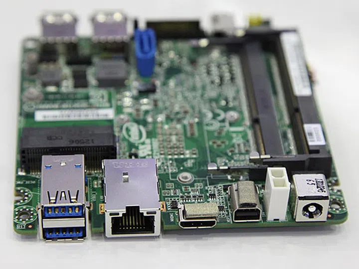 The rear panel ports (from left to right): Gigabit Ethernet, mini-HDMI, mini-DisplayPort, power connector.