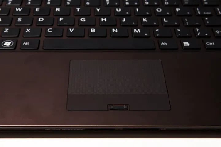 The finger-print reader of the Sony Vaio Z is tucked neatly in between the left and right 'buttons', which are marked by the areas which cease to have any textured pattern.