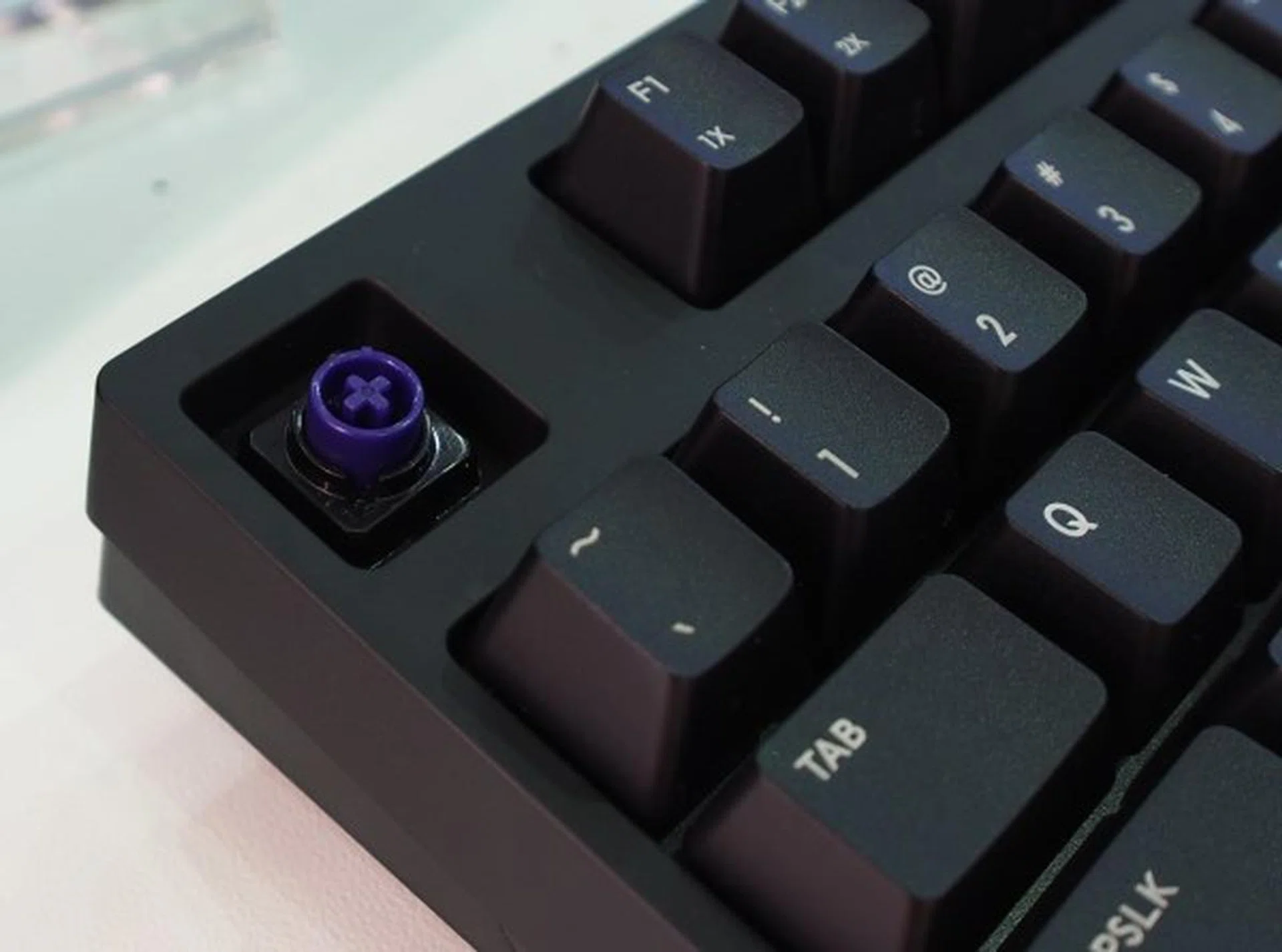 Cooler Master's own Hybrid Capacitive switch is compatible with Cherry MX key caps too.
