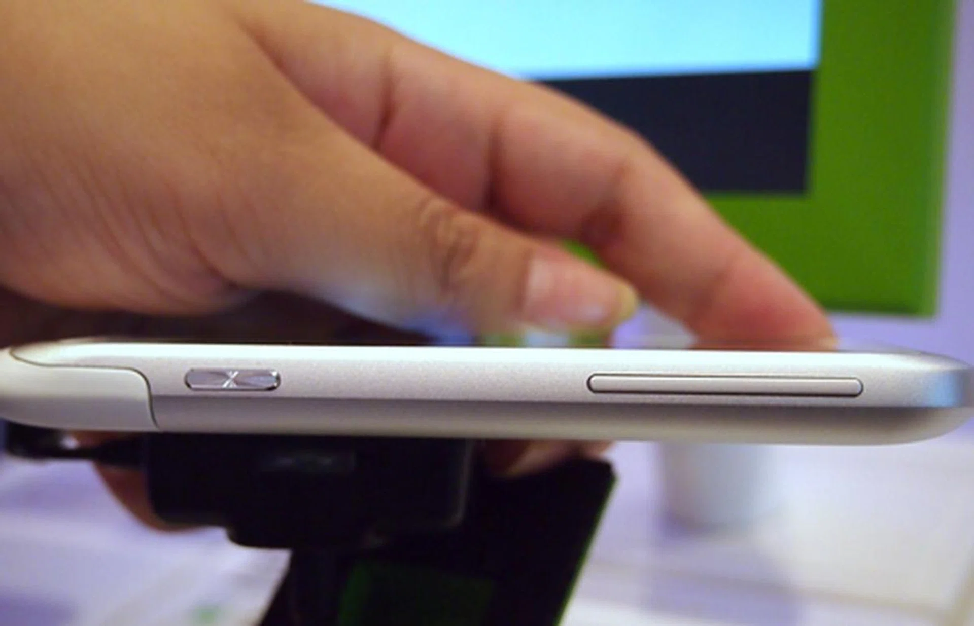A dedicated hardware camera button sits next to the volume button on the Radar's right profile.