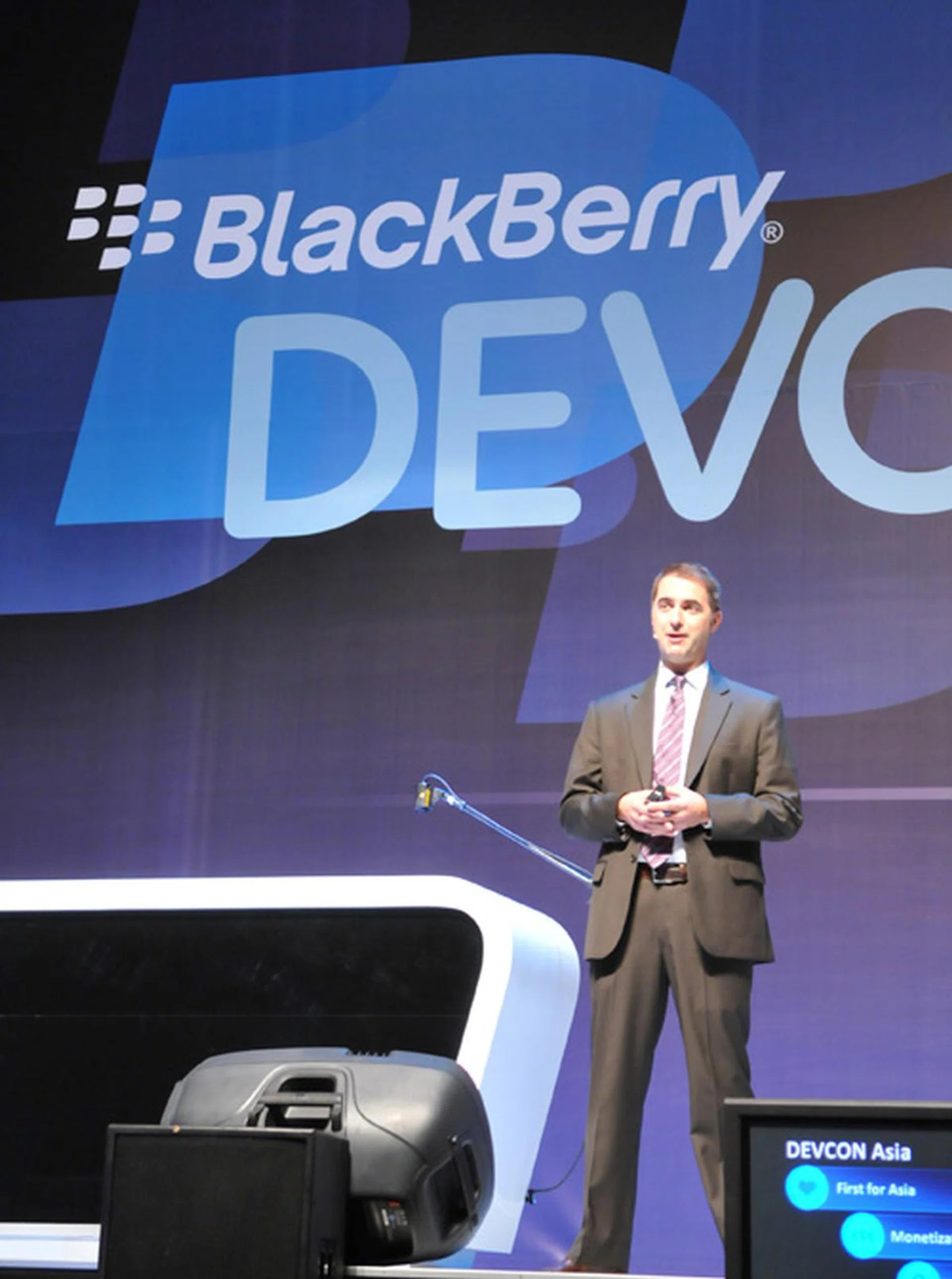 Gregory Wade, managing director for RIM Southeast Asia takes the stage for his keynote speech, occasionally whipping out the company's much-talked about PlayBook tablet to snatch a quick glance at his presentation notes.