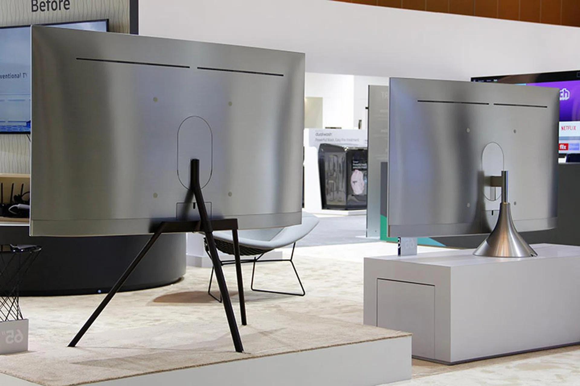 The separately-sold Studio Stand (left) and Gravity Stand (right) on the curved Q8C.