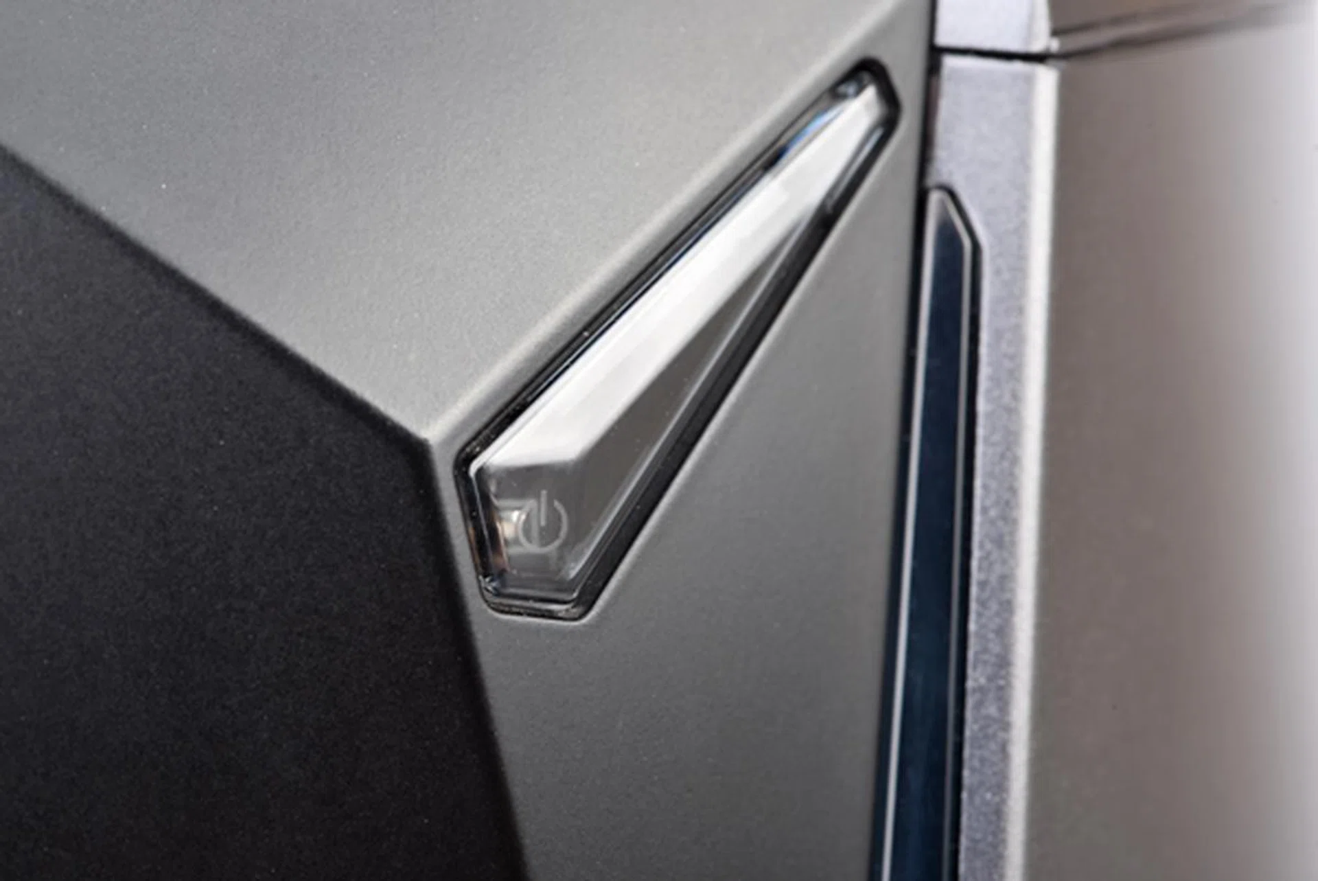 The Vortex also has a minimalist exterior, with the power button dominating the front.