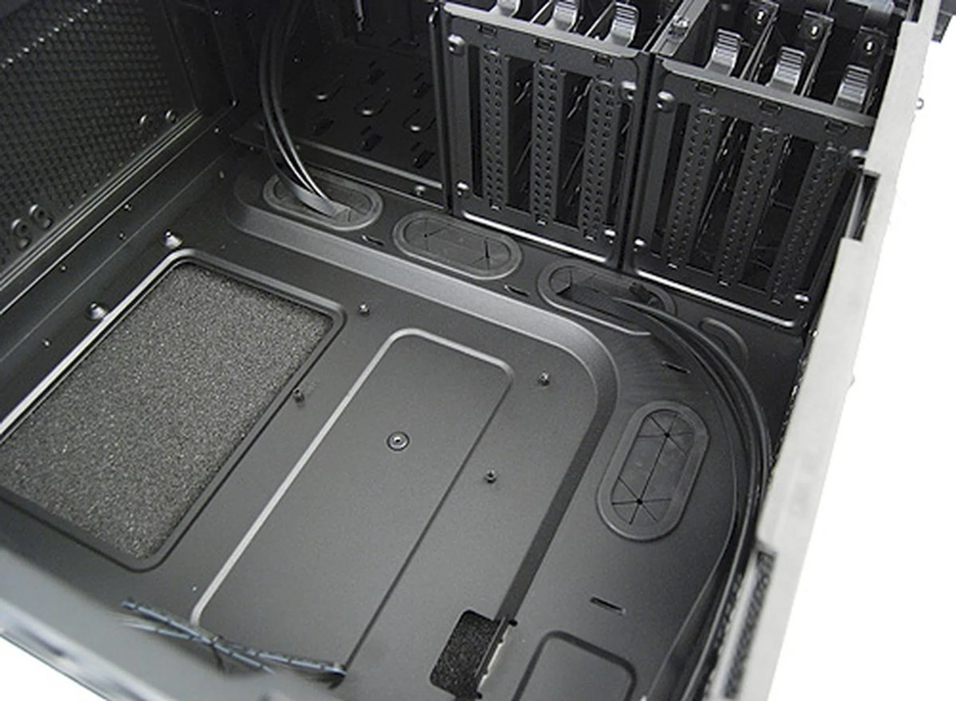 The motherboard tray has numerous cutoffs for cable management.