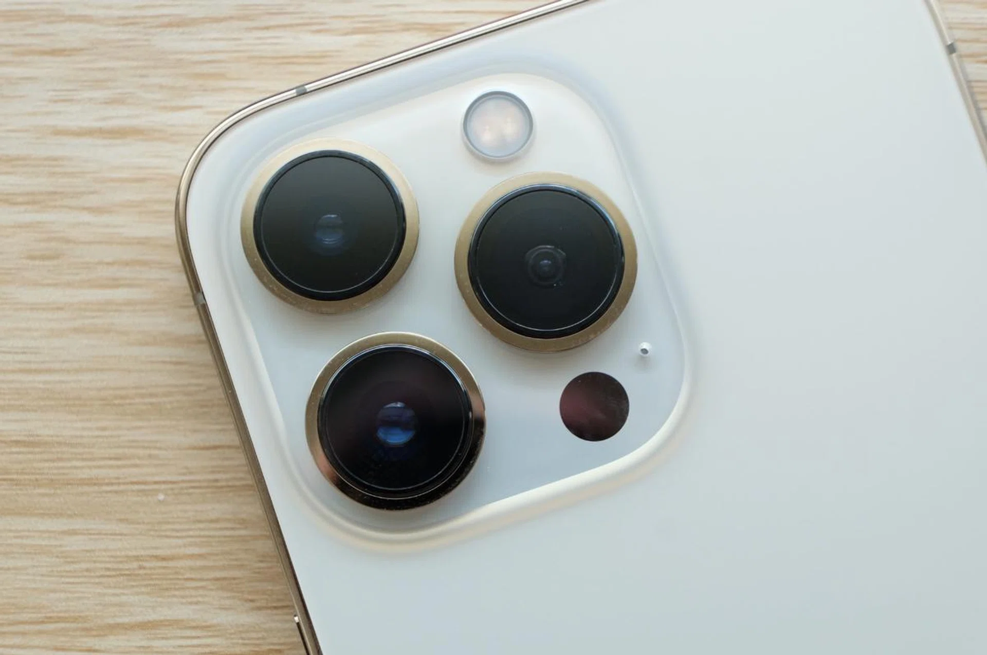 All three cameras have either improved sensors or lenses. There's also a lidar scanner.