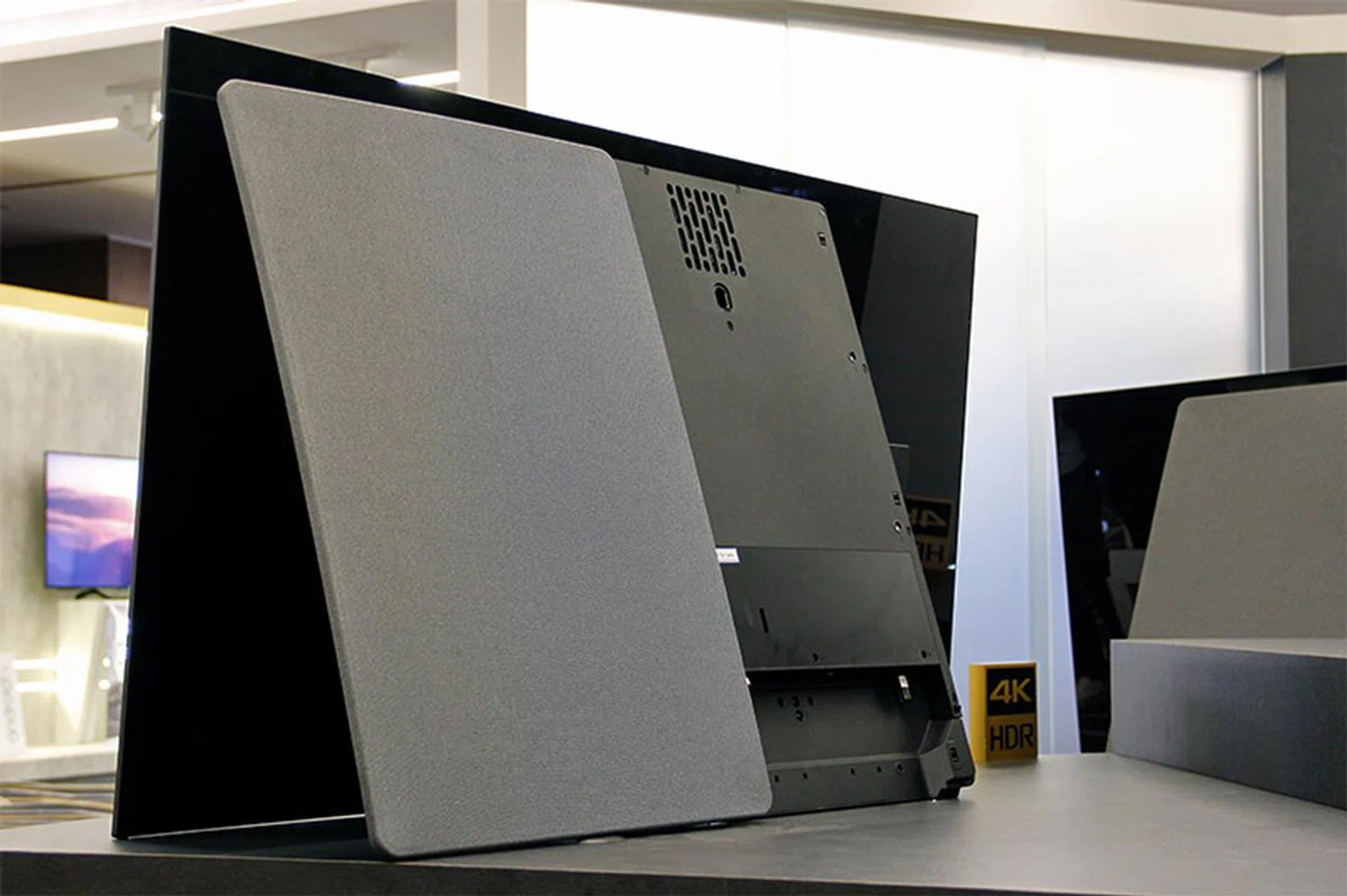 The back cover is removable, so that you can get to the ports, as well as do some cable management.