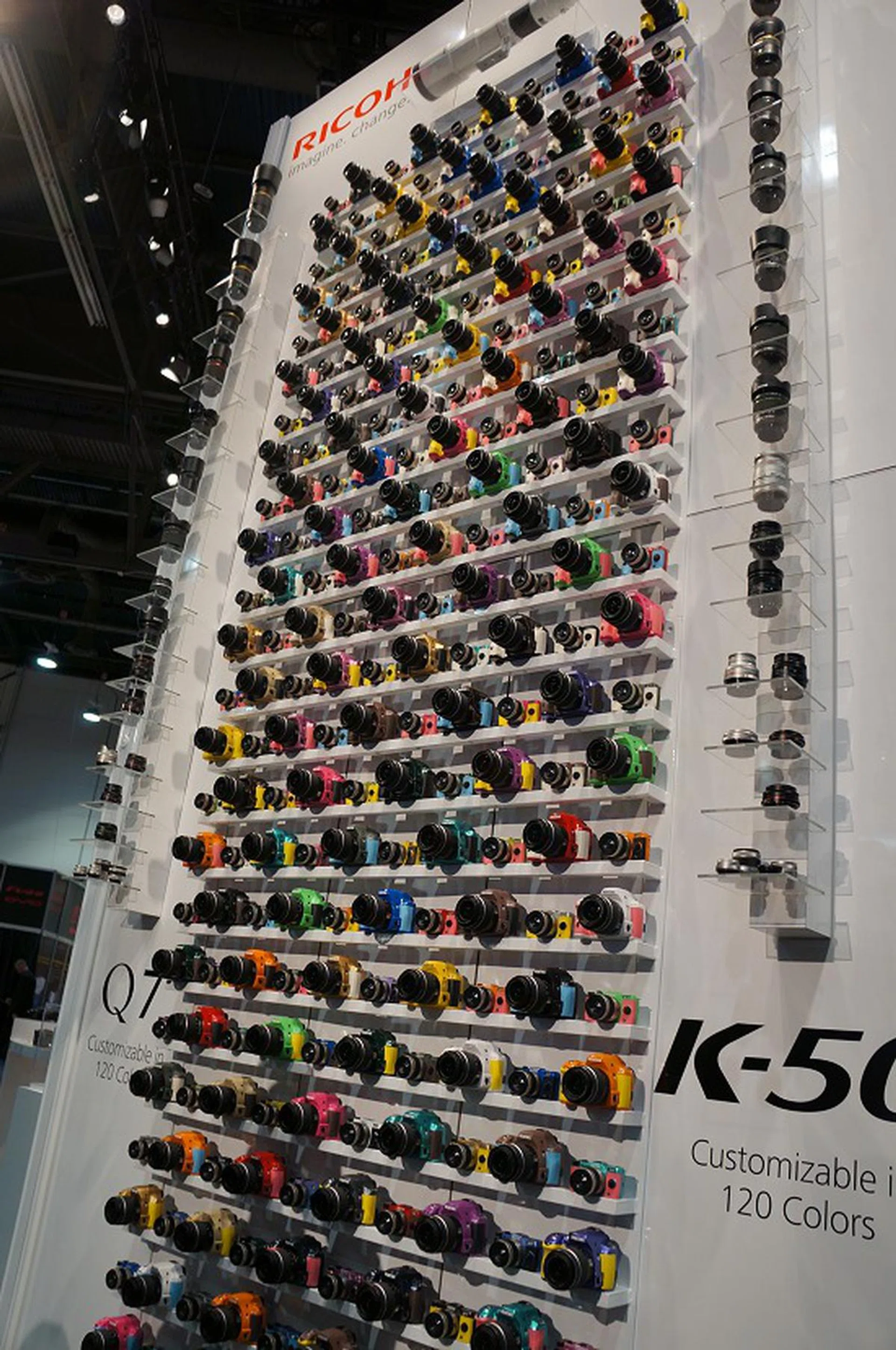 Behold a wall of colorful Ricoh cameras that greeted visitors to their booth.