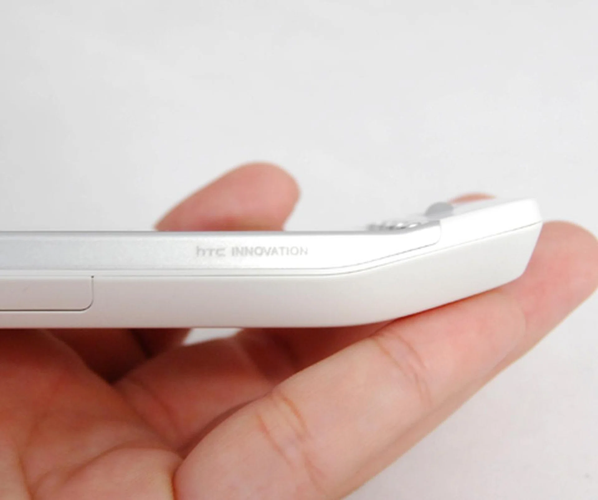 The curved chin guard is more or less here to stay on HTC's devices. It'll take some getting used to, but it will grow on you after a while.