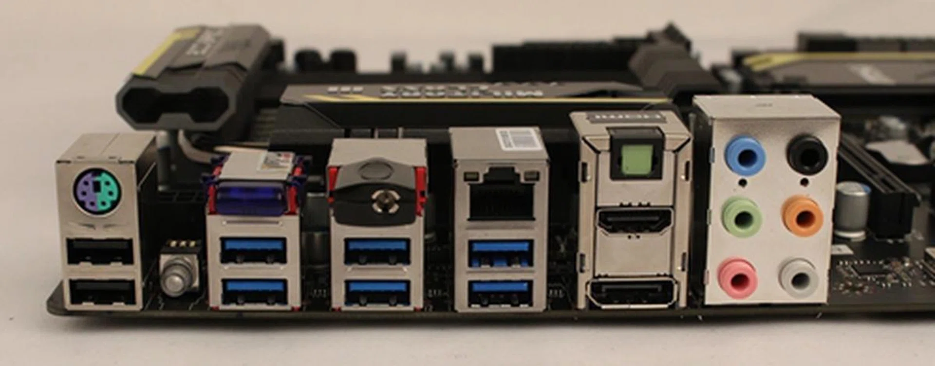 To the right of the black pair of USB 2.0 ports, we see the clear CMOS button that has a unique and kitschy '60s sci-fi design.