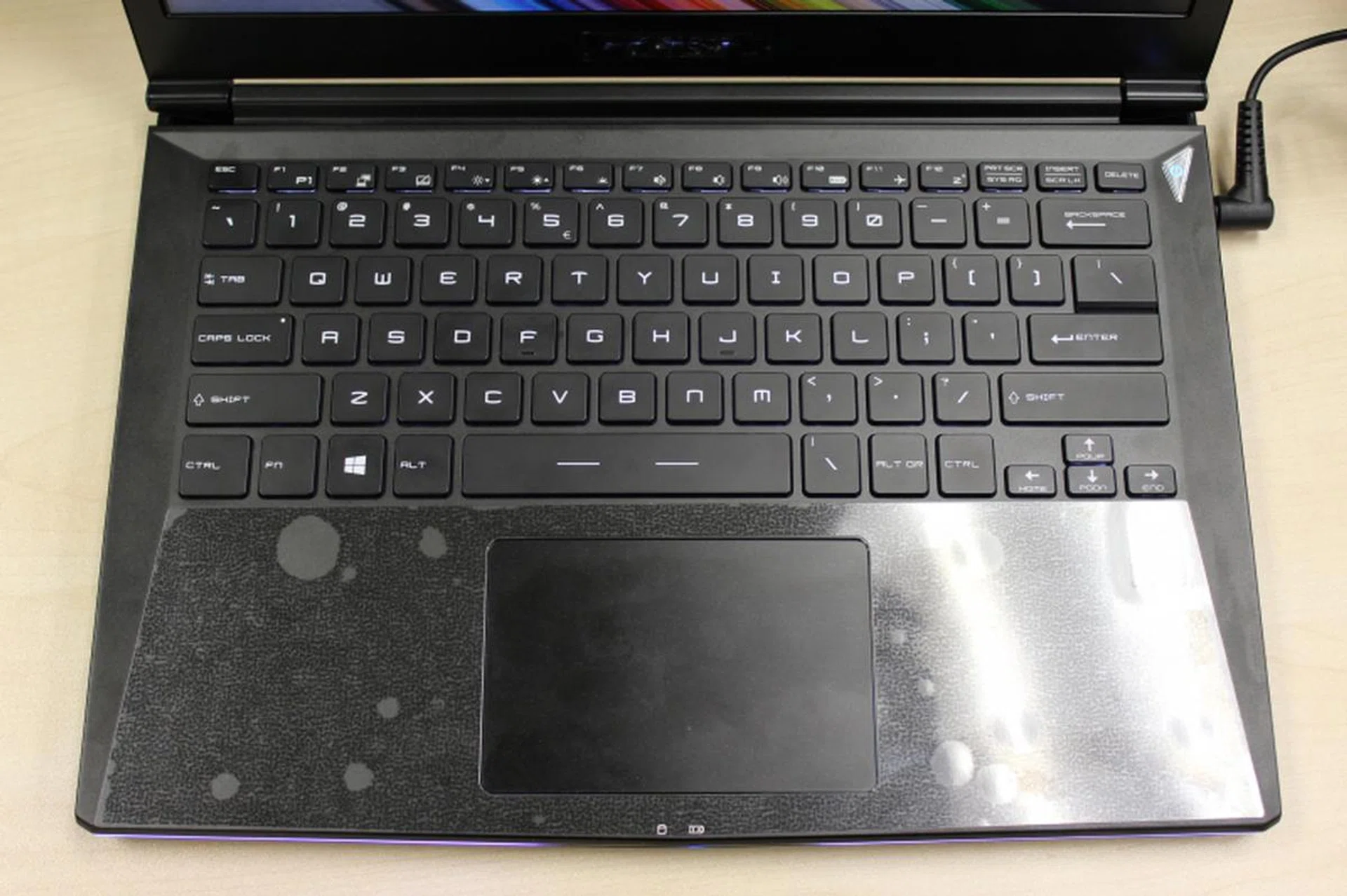 Looking down from the top, you can't really tell the keyboard's backlighted, unless you look closely under the Function keys on top. It's still visible in the dark though.