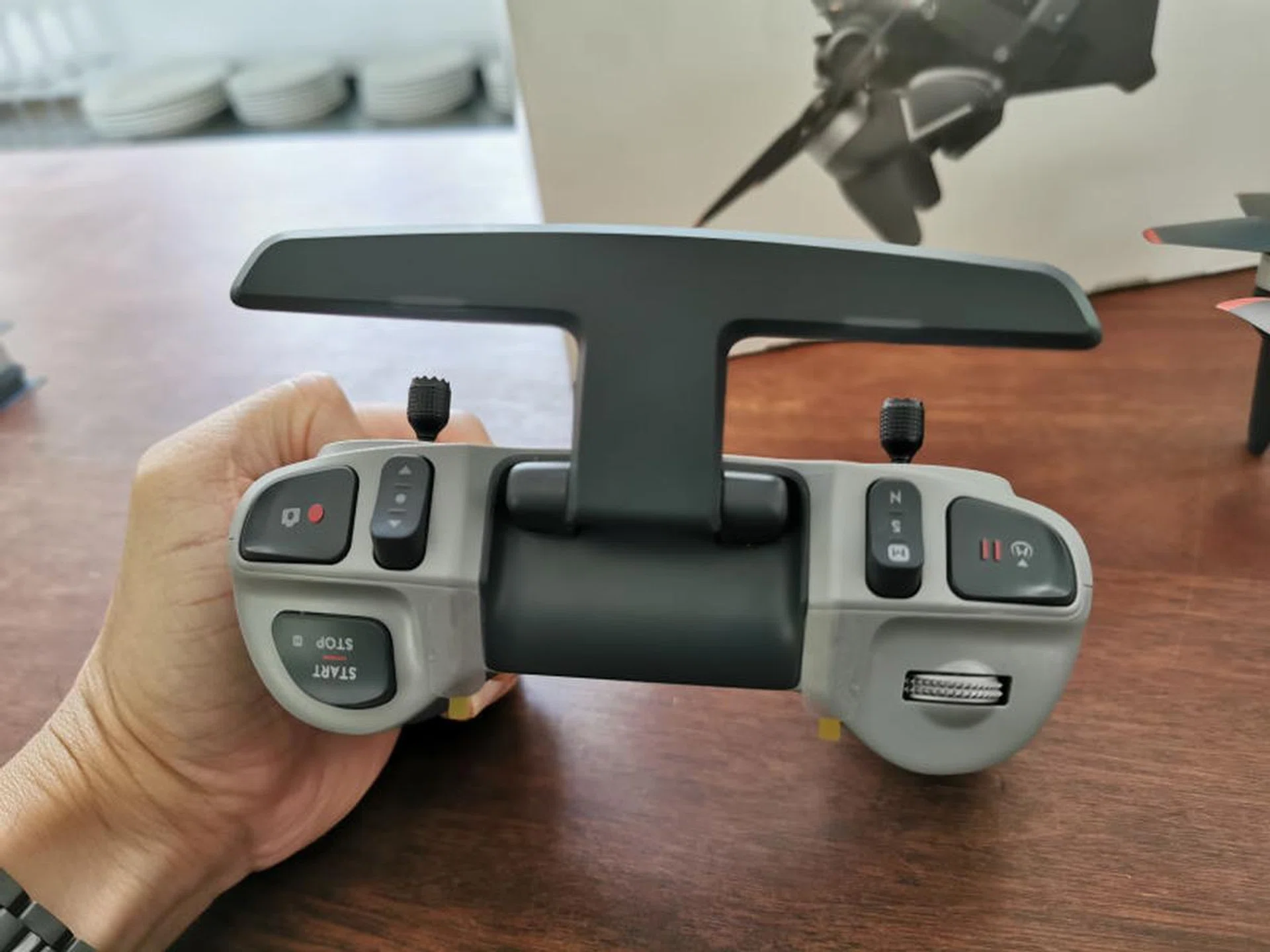 The top trigger area of the FPV controller is quite packed. If you're flying with the goggles, you'd best familiarise yourself and get enough muscle memory going on first.