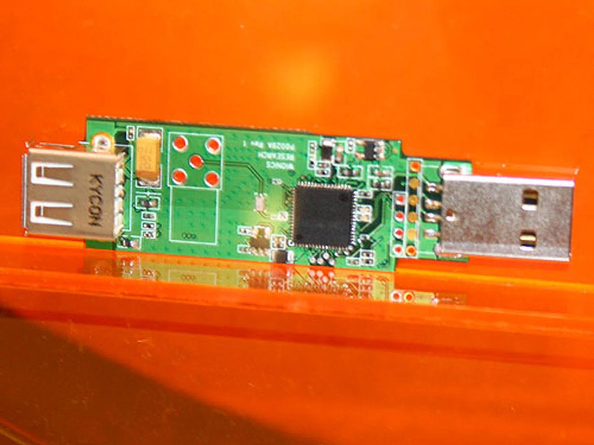  Another wireless USB dongle with a USB upstream port for firmware upgrade and cable association and a downstream port for connecting to any existing USB device.  