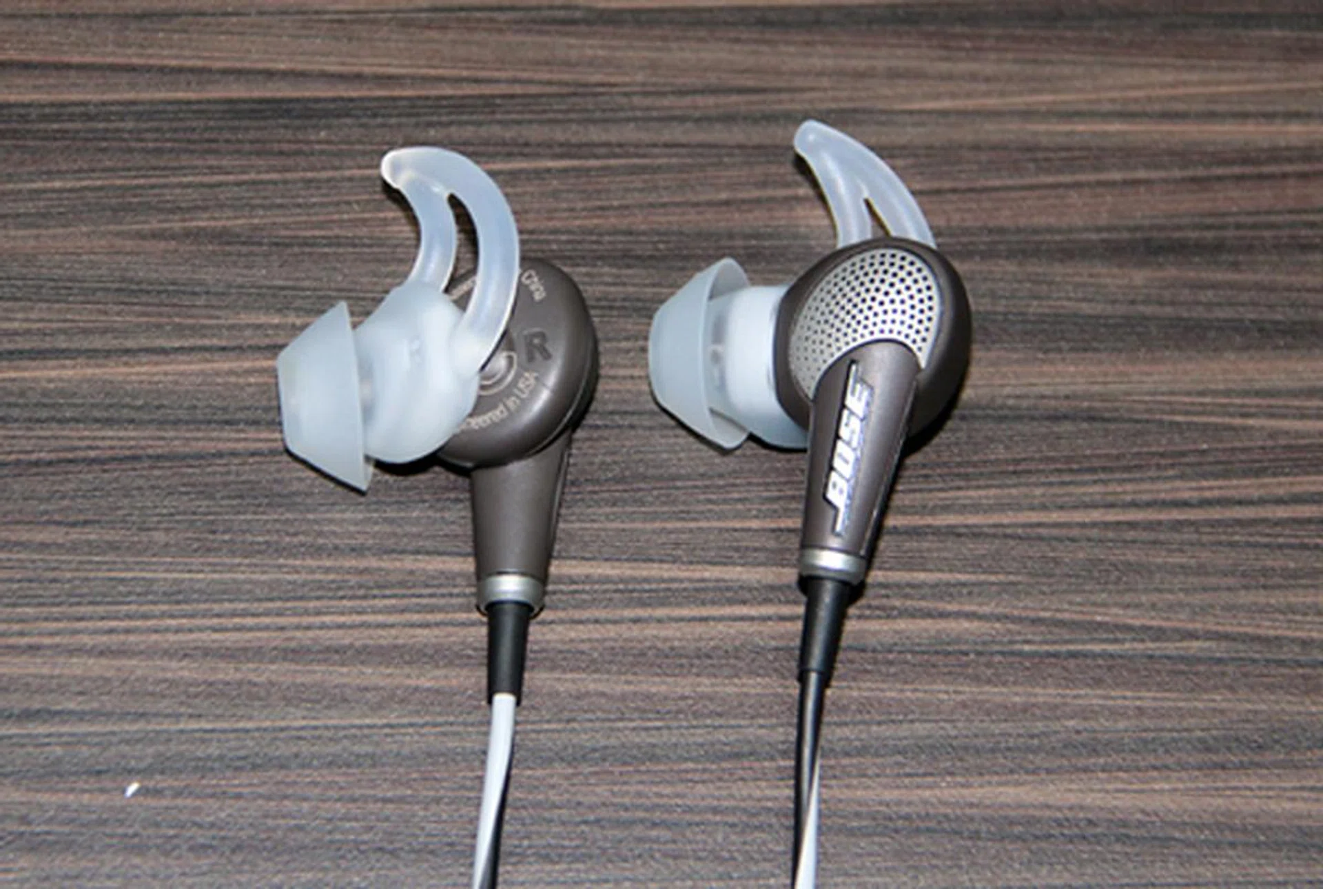 A close up view of the new Bose QuietComfort 20 earphones. The proprietary StayHear wing-like ear-tips are intended to provide a snug, noise isolating fit.