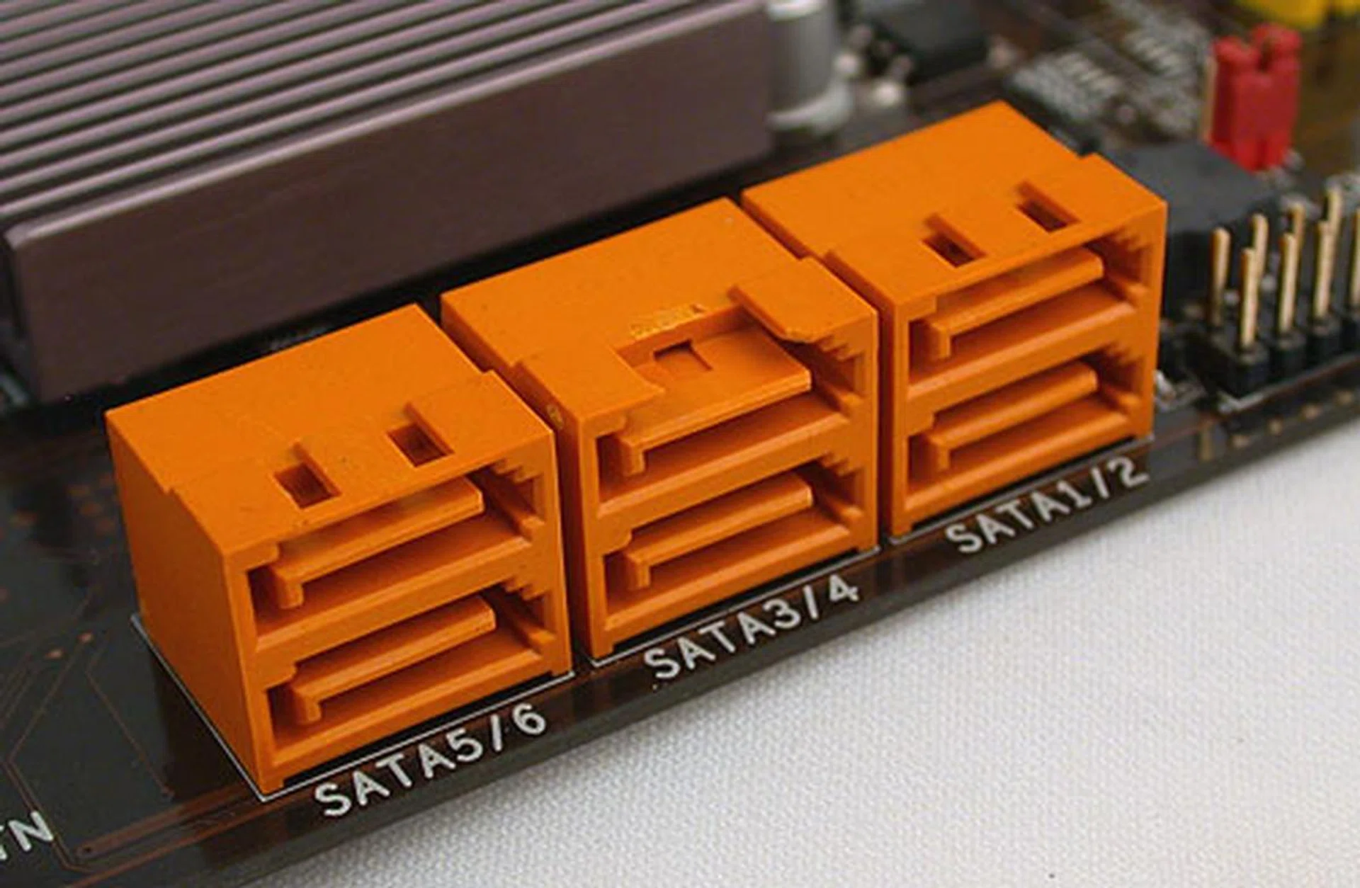 Yes, one of the SATA ports here got chipped during the trip to our labs. ECS supports the minimum six provided by the Intel chipset, not including the rear eSATA port that is powered by a JMicron controller.