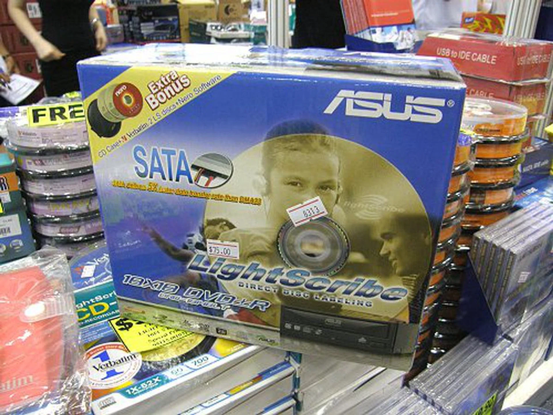  The ASUS DRW-1814BLT has got to be one of the most attractive DVD writers out there today. With 18x writing speeds, LightScribe functionality and SATA interface, the drive is only going for S$75 at Chamoxa's booth. It is even bundled with two LightScribe discs for your to mess around with. For those interested, you can read up our recent full review of this optcial drive to know our personal take as well.  