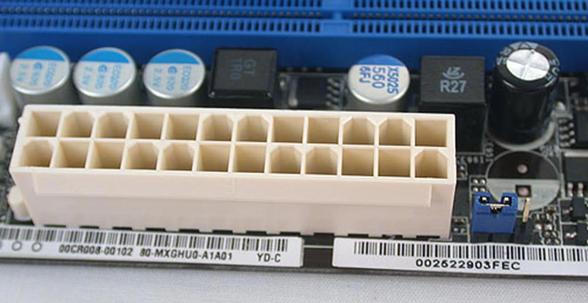 This board only has one power connector - this 24-pin ATX power connector. A clear CMOS jumper is right besides it if you need to reset the BIOS.