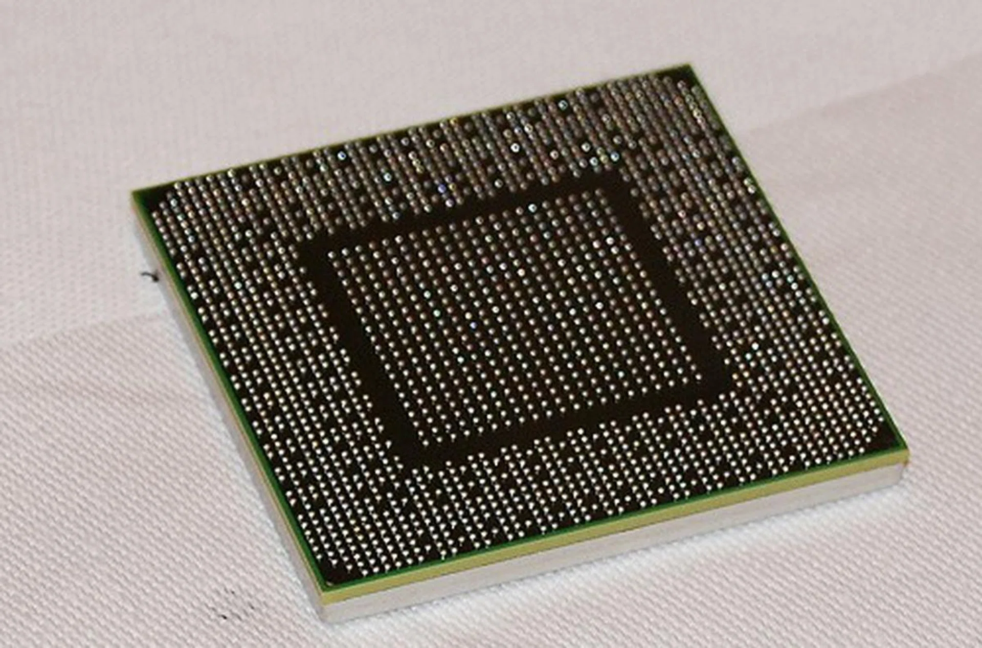Here's the back of the GPU and its ball-grid array of contact pads.