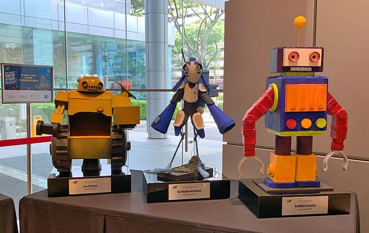 These are the awesome trophies for the primary, secondary, and tertiary student winners of the HP Make IT Green Campaign - Mech Robot Competition. Their drawings formed the blue print of the Mech Robot replicas, which are made from the remnants of old electronic devices.