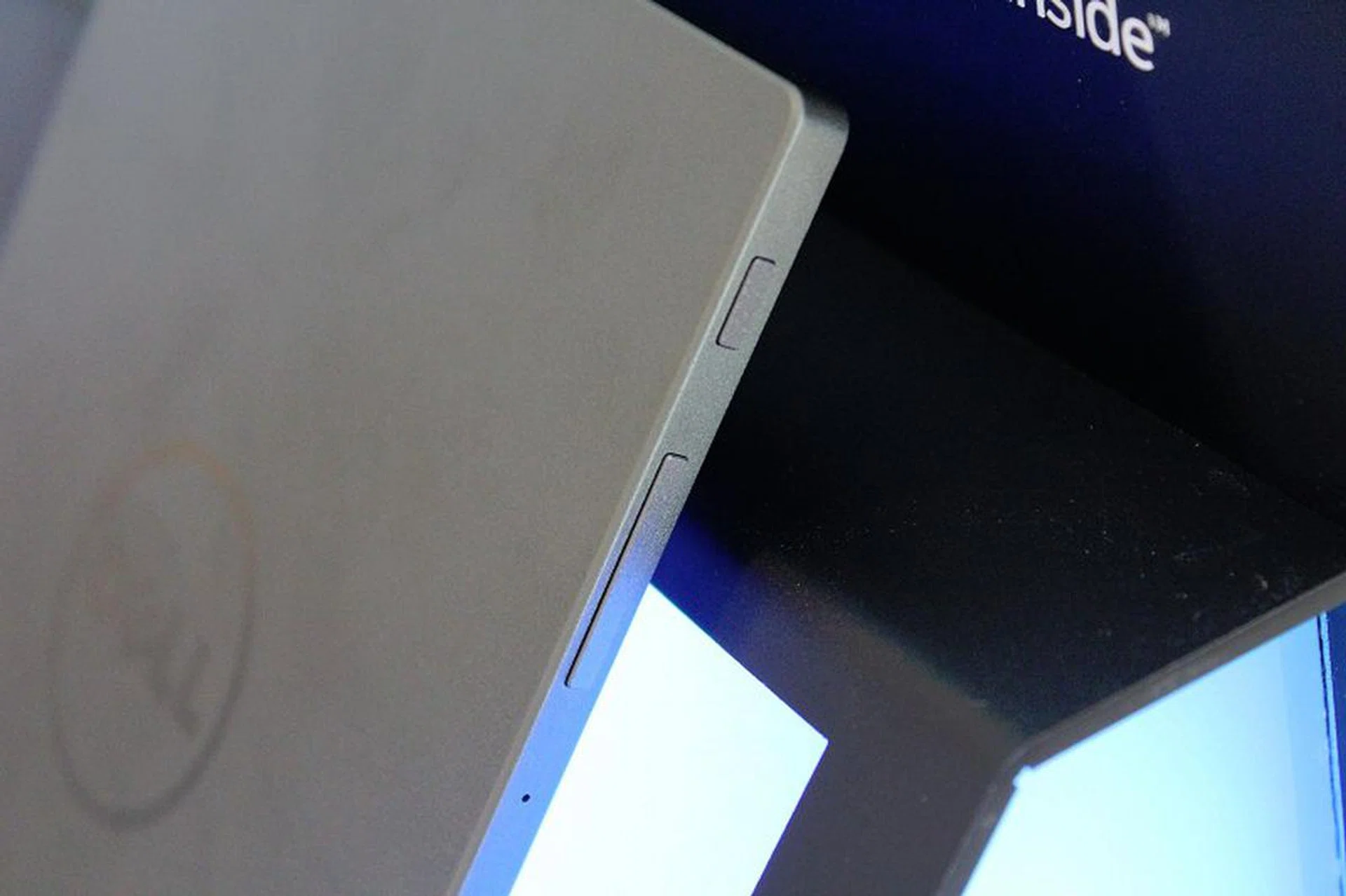 The volume and power buttons are on the top left of the tablet.