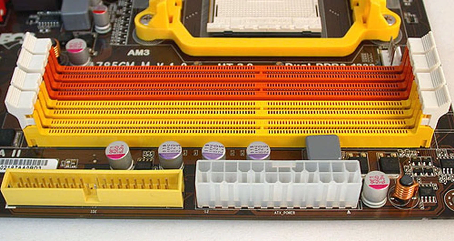 Everything looks entirely normal here, with four DDR3 DIMM slots above the power and IDE connectors.