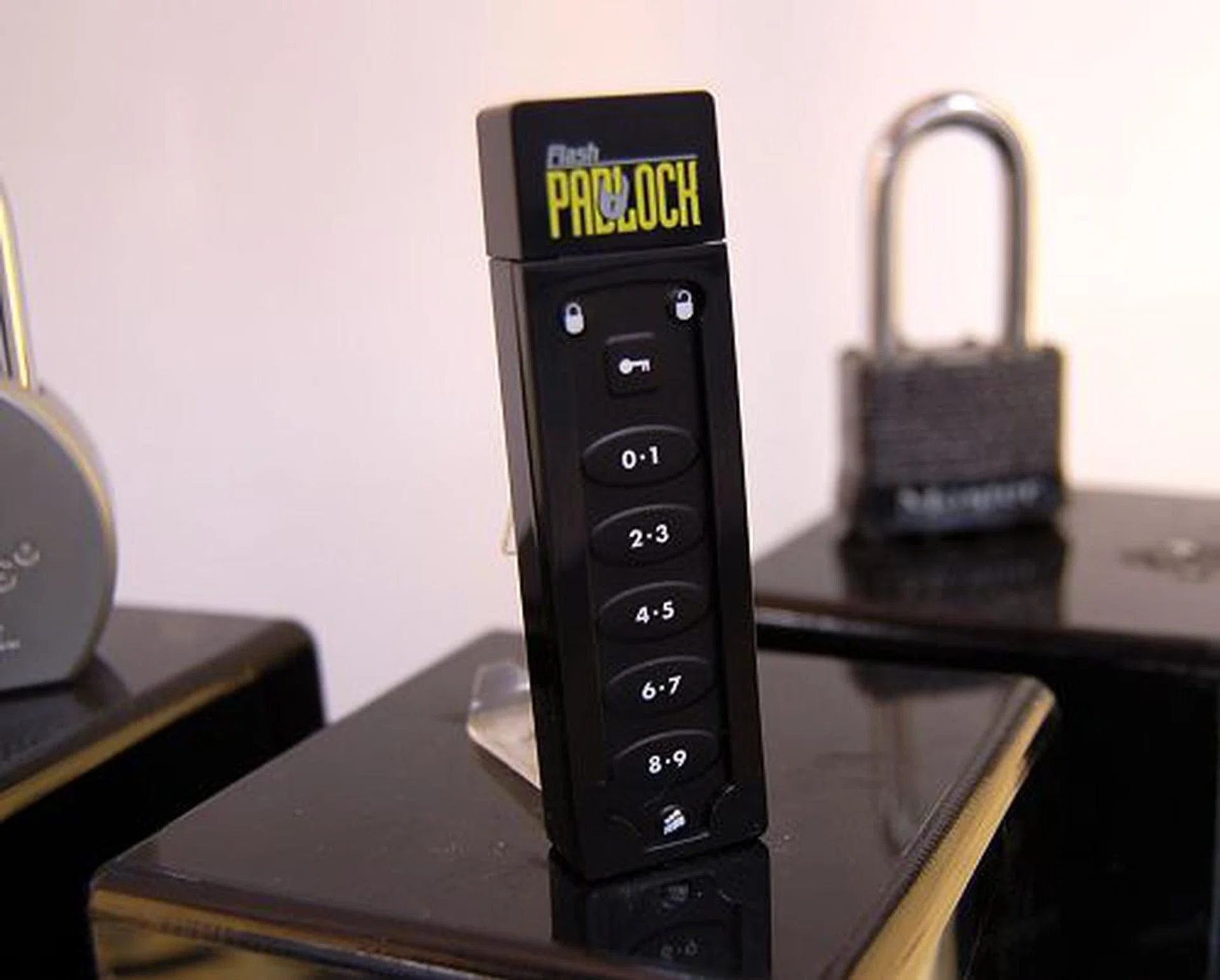  The Corsair Flash Padlock drive dispenses away of the 'high-tech' finger-print scanning function adopted by other security-class flash drives and uses a conventional numeric-lock system. Without inputting the right sequence, this unit will not be detected by the OS at all because the flash storage and the padlock system are isolated from each other. Only upon successful numeric entry, it will provide power to the flash unit's power plane, thus enabling the user to see the drive in the OS. And once unplugged from the system, this Padlock drive resets itself back to square one, requiring authentication. Upon authentication, there's only a 20-second time slice to allow you to plug it to the system (indicated by a flashing green LED), after which it will self-lock like a mobile phone. It too will be available in the mid-year time frame.  