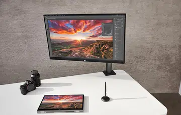 LG UltraFine Ergo monitor (centre).