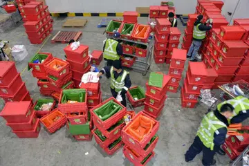Online grocery store RedMart's staff at work. Credit: The Straits Times.