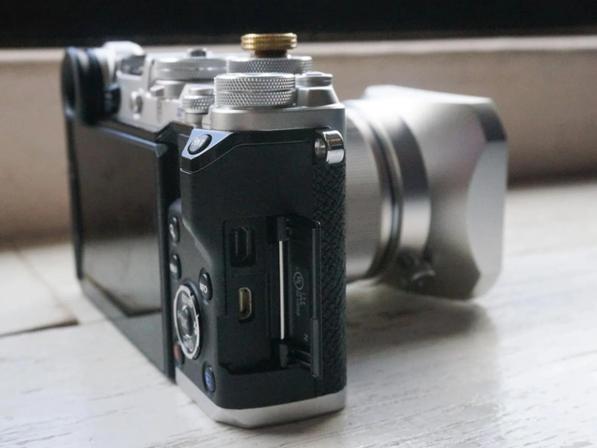 The ports are to the right of the camera.