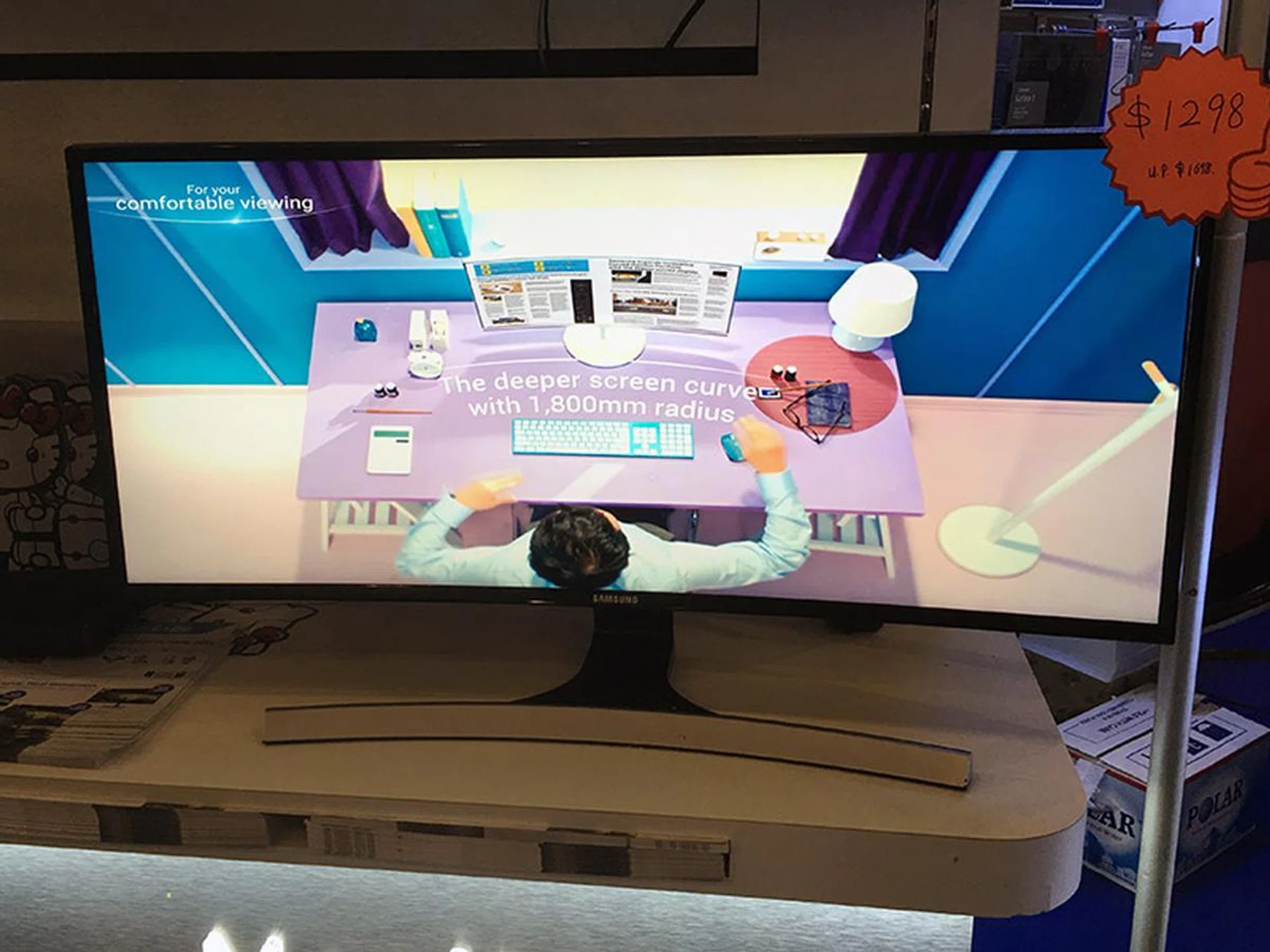 The Samsung S34E790CS is a 34-inch curved monitor, with a 3,440 x 1,440-pixel resolution. It has 7W x 2 built-in speakers, a 4ms response time, and supports wall mounting. Going for $1,298 and comes with two Samsung Special Edition 3" Robot Kitty figurine sets and HDMI cable.
