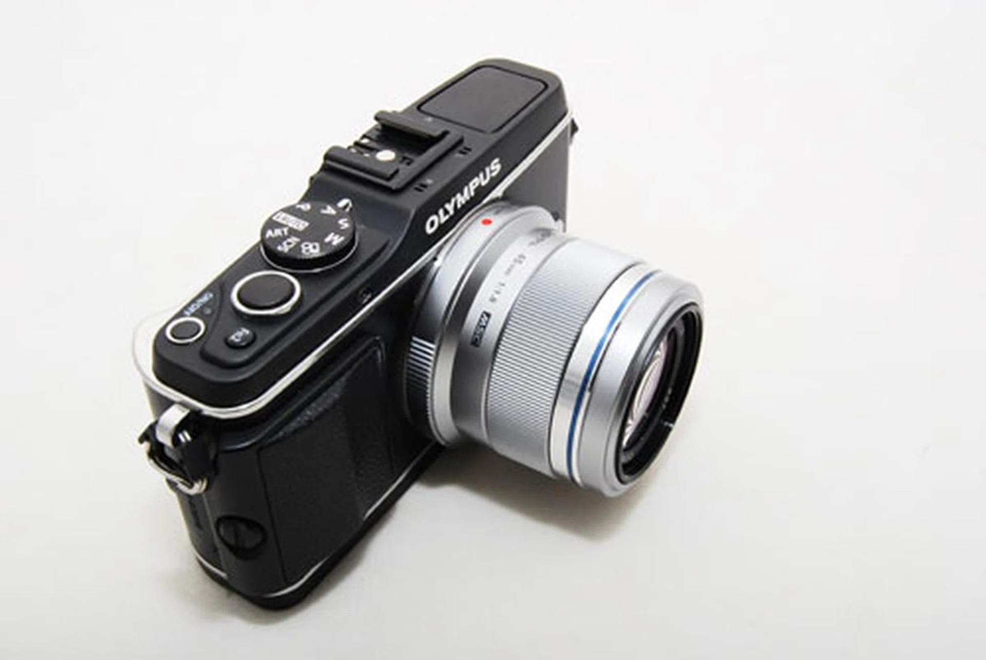 The 45mm when mounted on an Olympus E-P3. The lens doesn't add much size to the camera.