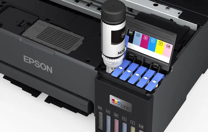 Topping up the six ink tanks. Image source: Epson. 