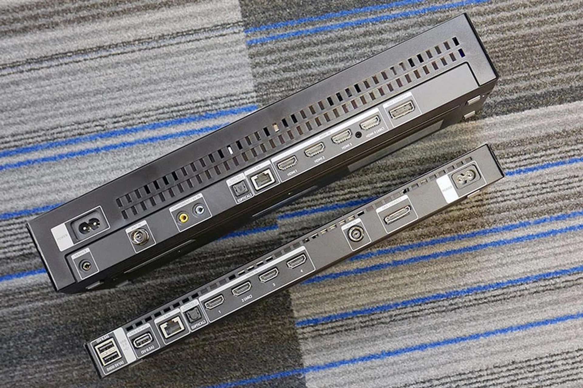 Because it now takes on TV power supply duty, the 2018 One Connect Box is bigger than the 2017 One Connect Box.