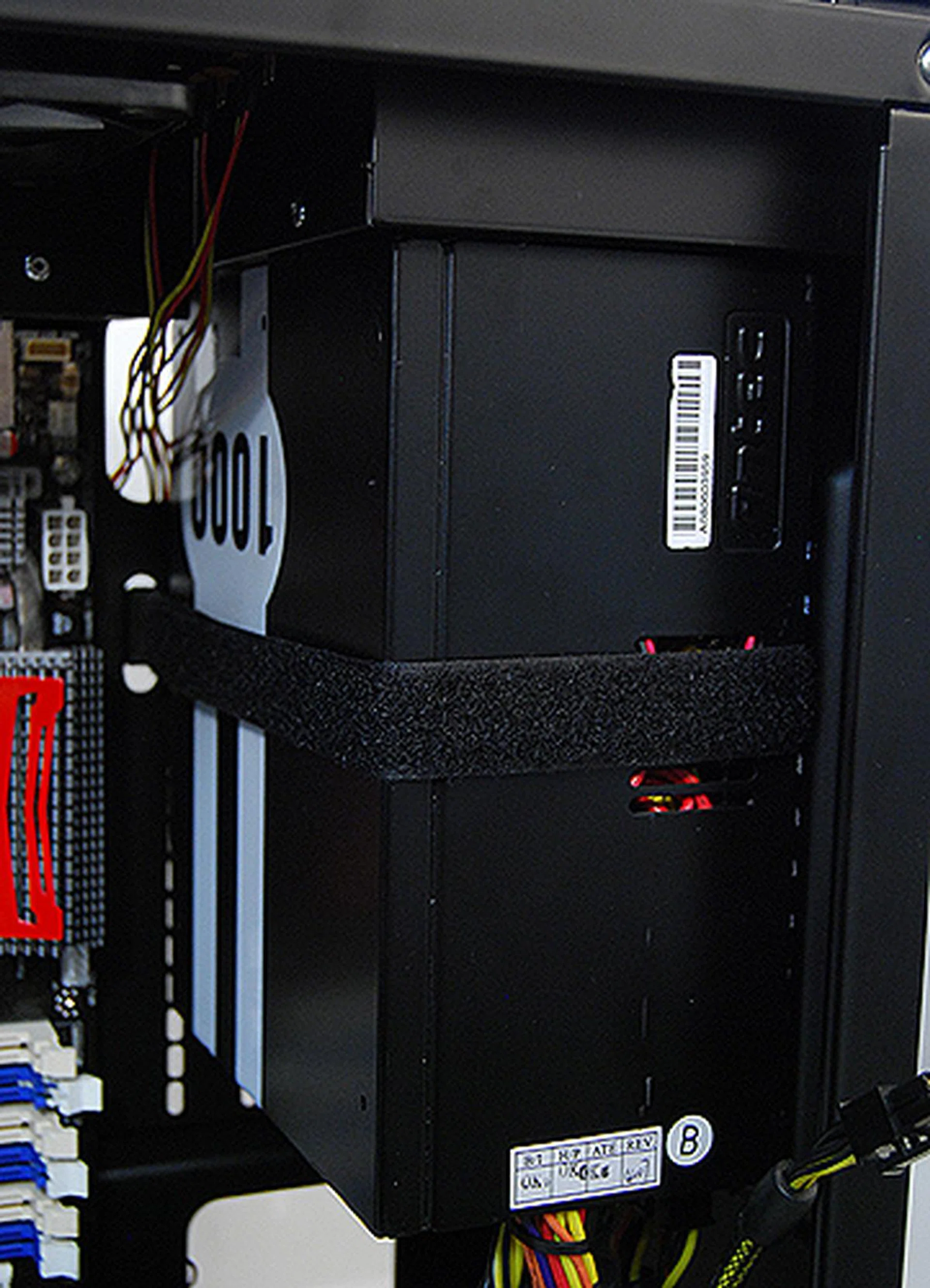 Installing the PSU was a drag. Because of it has to be vertically mounted, there was no PSU tray and therefore we had to turn and rotate the casing around numerous times to ensure a good fit. SilverStone also recommends tying a strap around the PSU to the casing to prevent it from swaying about during operation.