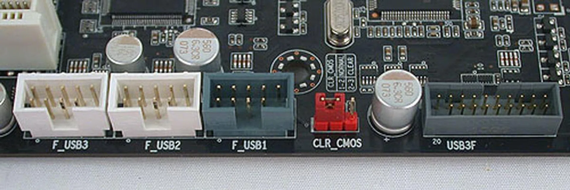 USB headers galore! A Clear CMOS jumper is sandwiched here, though we obviously will be using the Clear CMOS button at the rear panel.