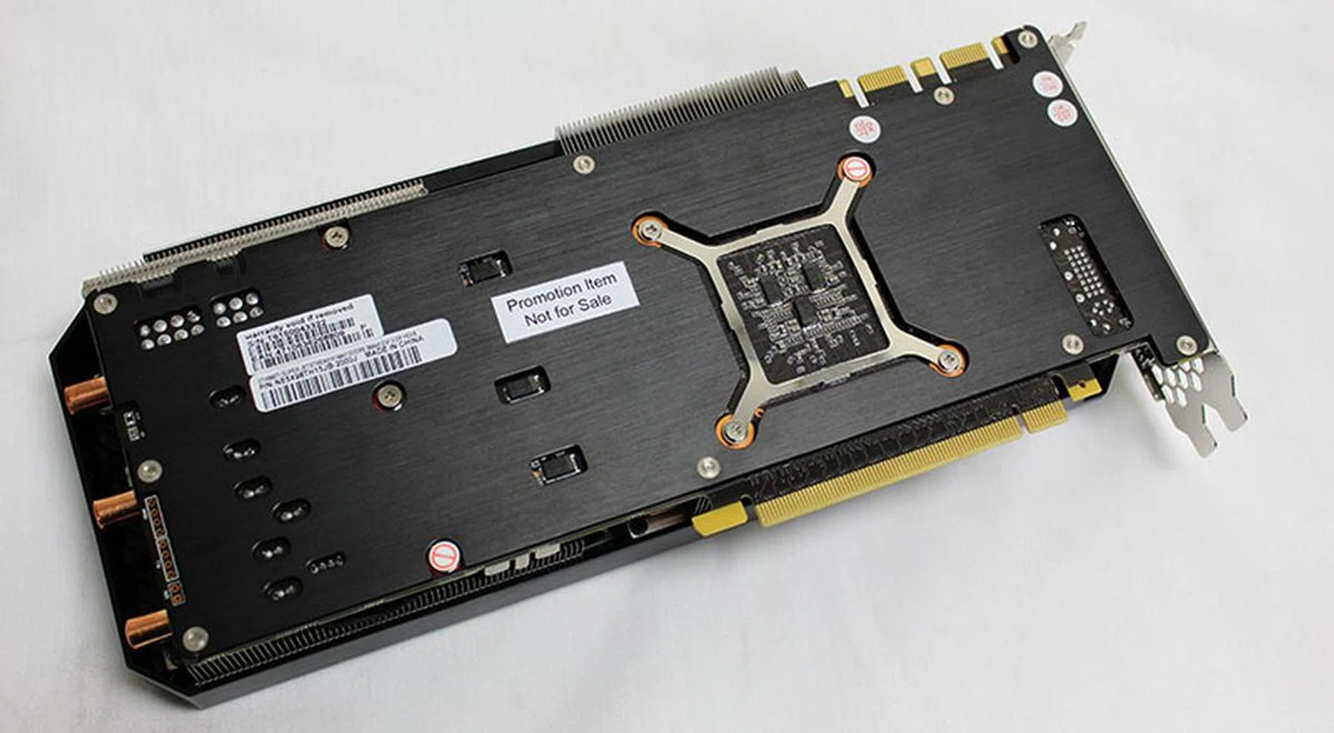 The card's backplate includes a GPU cutout with an additional reinforcement plate for the GPU.