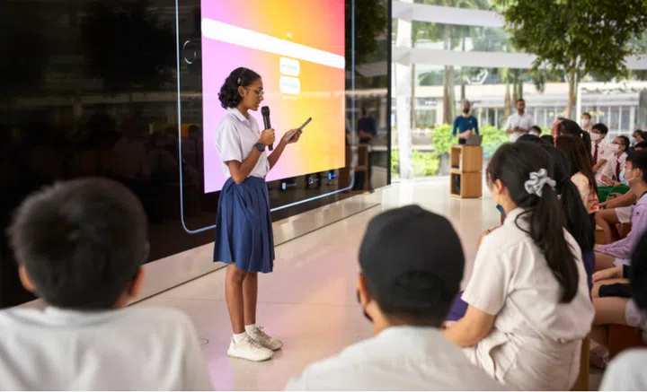 A student from Presbyterian High School presenting their app, Chater, to audiences at the Swift Explorers Singapore celebration at Apple Marina Bay Sands. PHOTO: APPLE