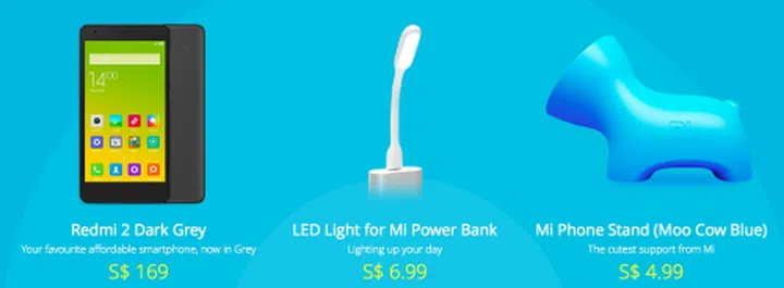 The Redmi 2 (grey), LED Light for Mi Power Bank and Mi Phone Stand are three of the five new items that will be sold on April 8 in Singapore. <br> Image source: Mi Singapore
