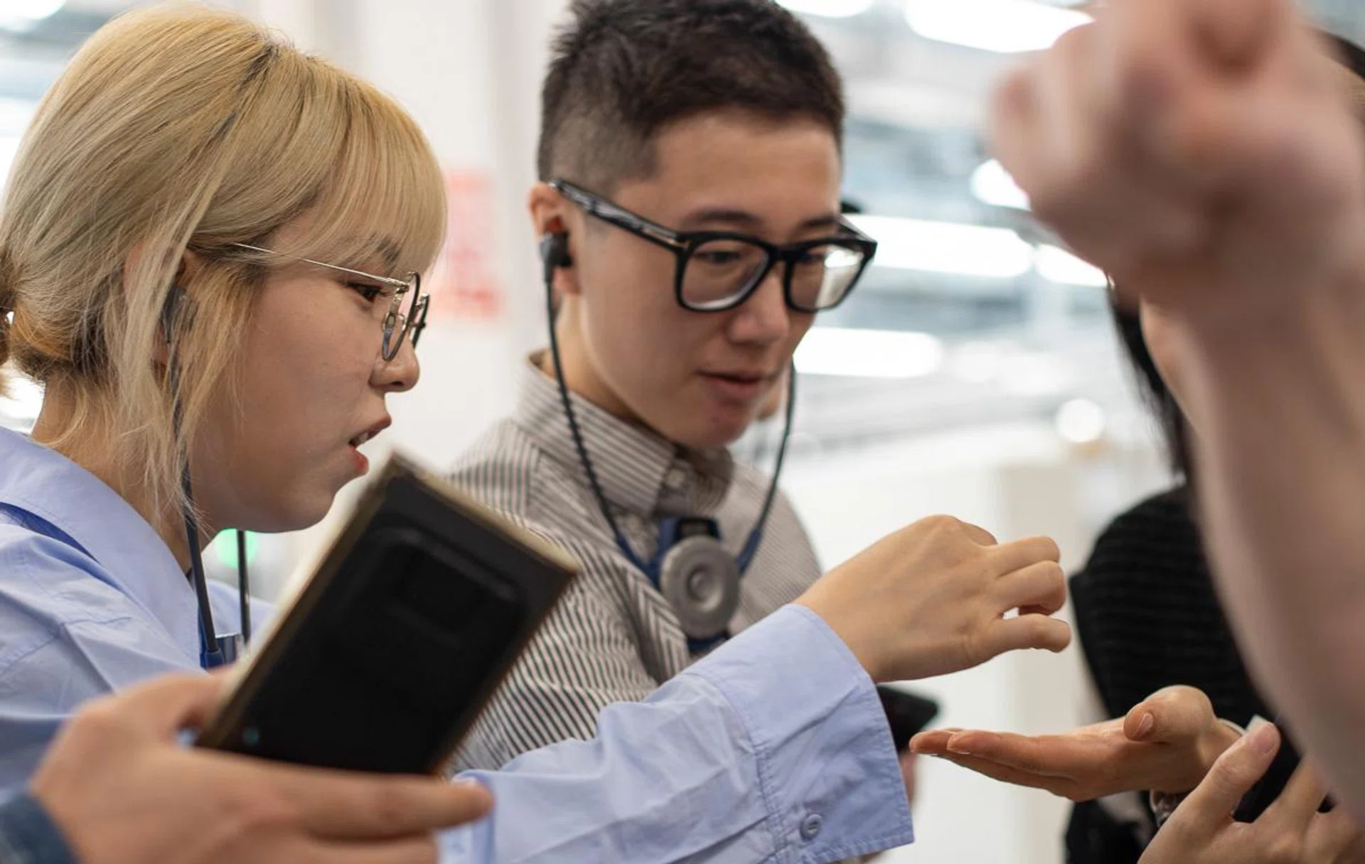 Look at us marvelling over 0.03mm thick wire. Photo: Sennheiser