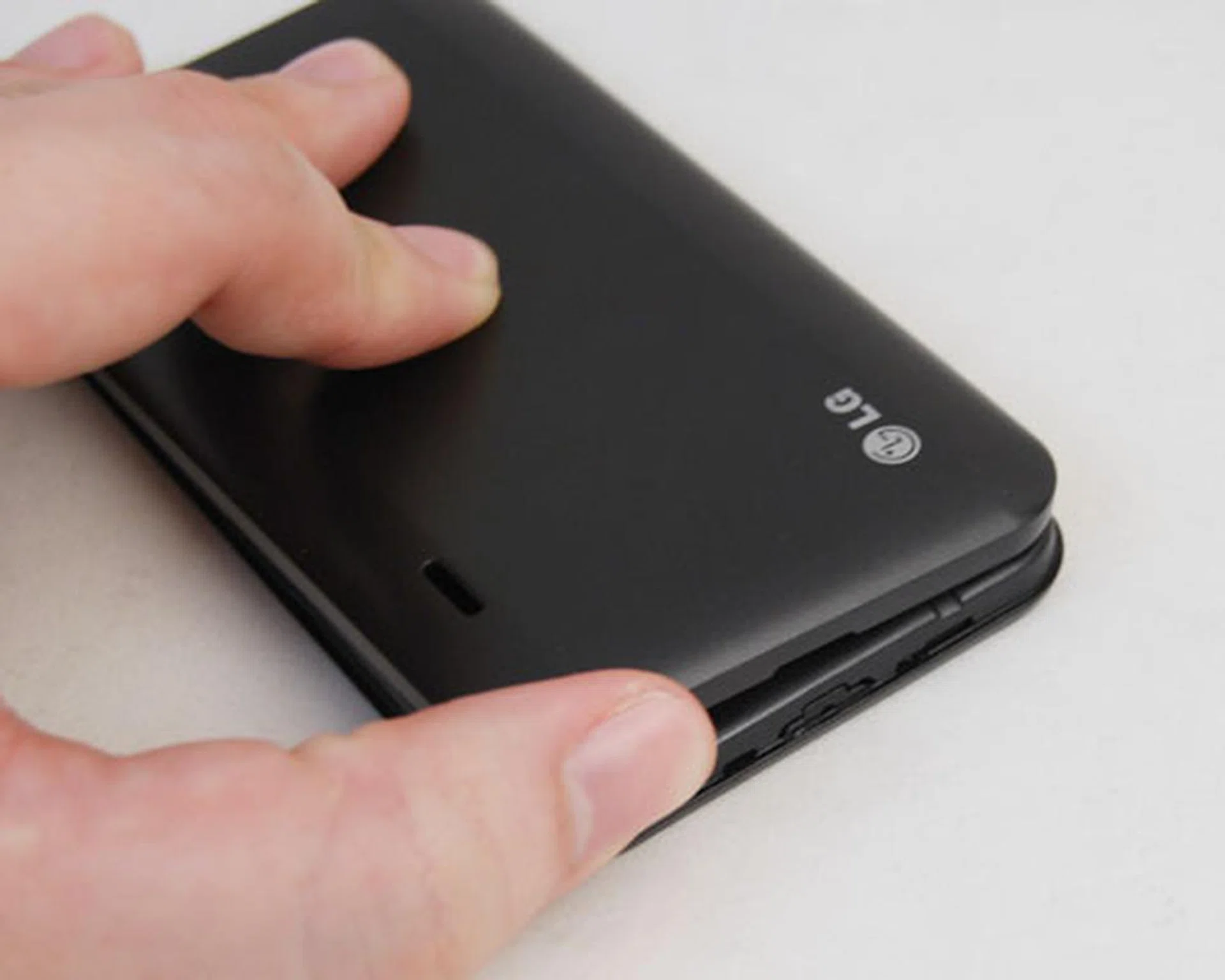 The flimsiness of the plastic frame is felt as we pried the cover open to access the battery and microSD card beneath.