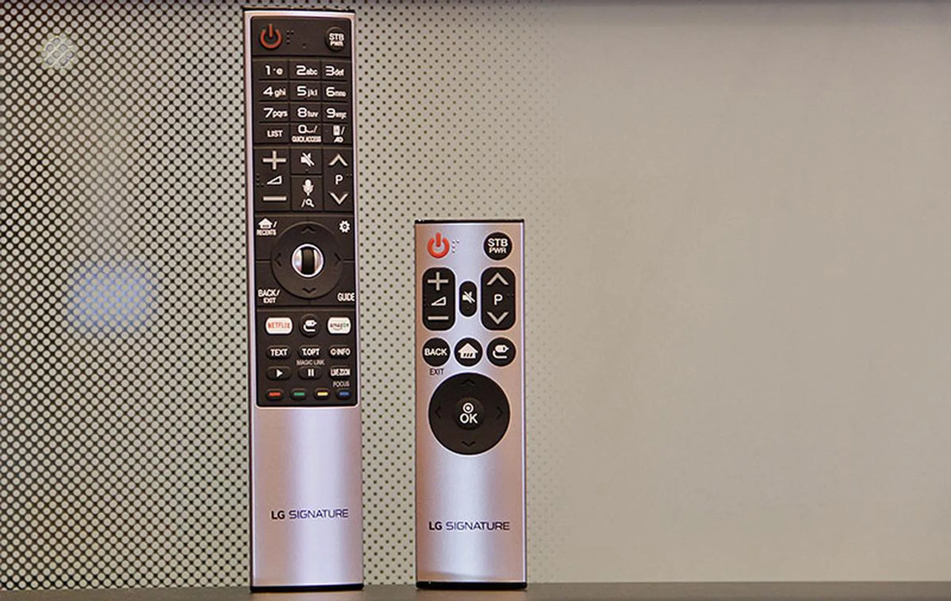 The Signature models' Magic Remote is styled a bit differently from the other models' Magic Remote. They also come with another shorter remote that has fewer keys.