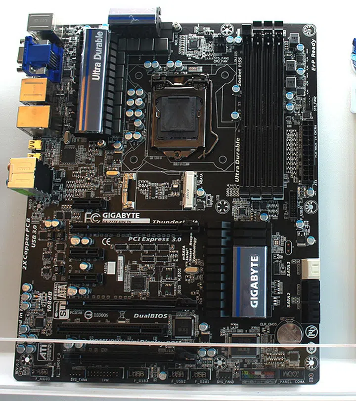 The Gigabyte GA-Z77X-UP4 TH
(In case you are wondering, that grey line near the bottom of the image is actually a piece of glass from the display stand.)