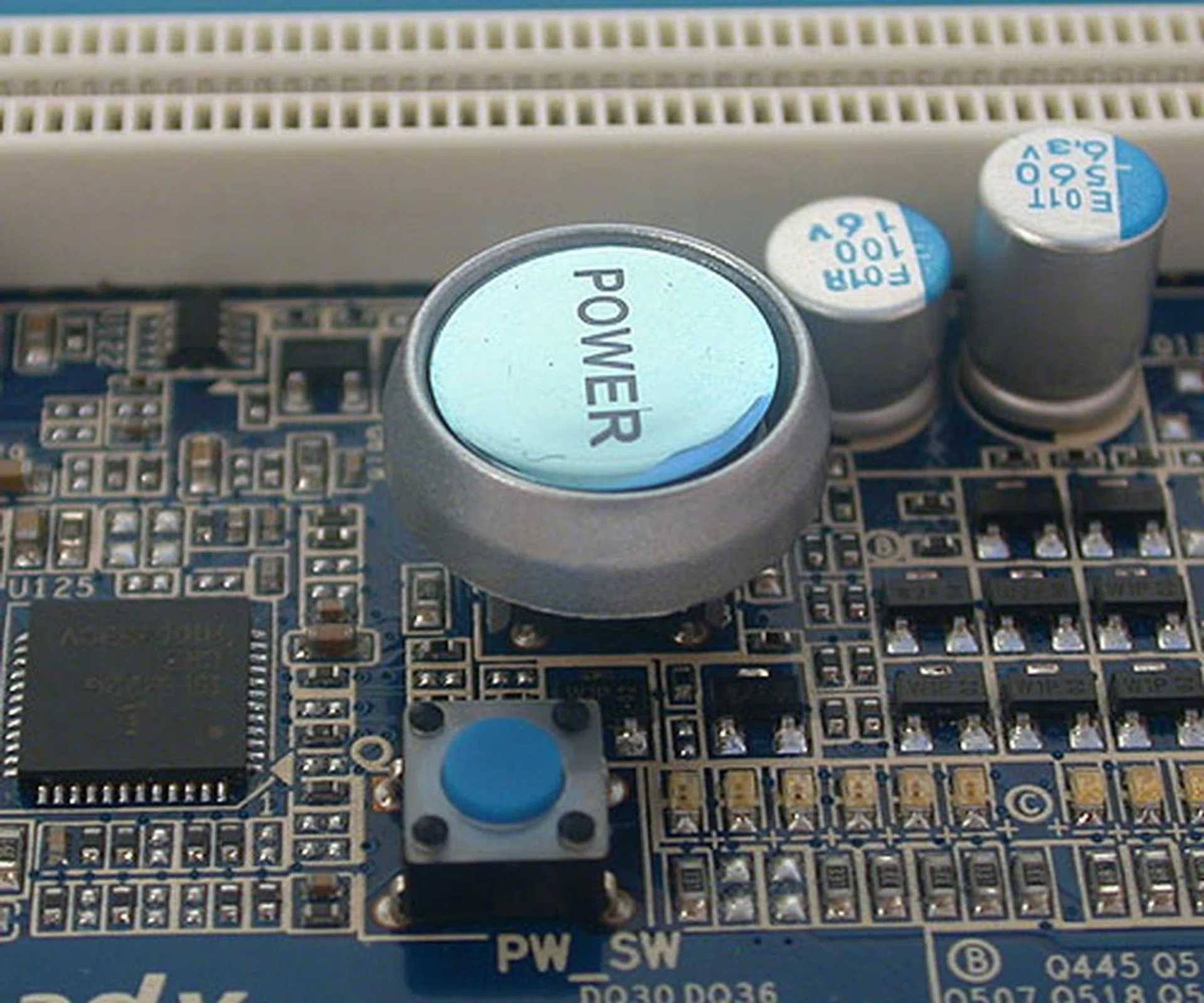 A large power button and the much smaller reset button.