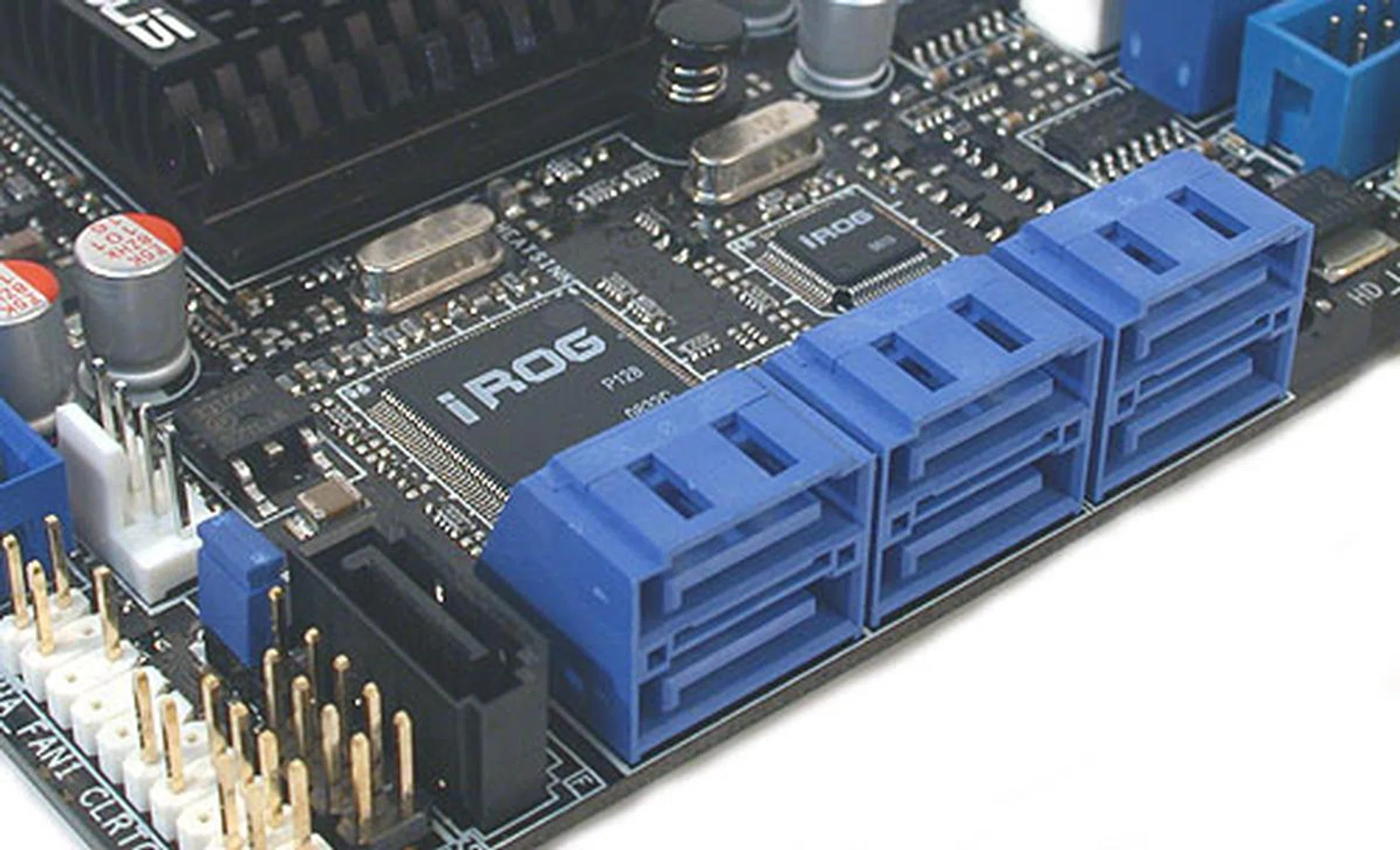 The six blue SATA ports come from the ICH10R hub with the sole black SATA port from the JMB363 controller. You can also get a glimpse of the ASUS iROG chip here that enables the overclocking features on this board.