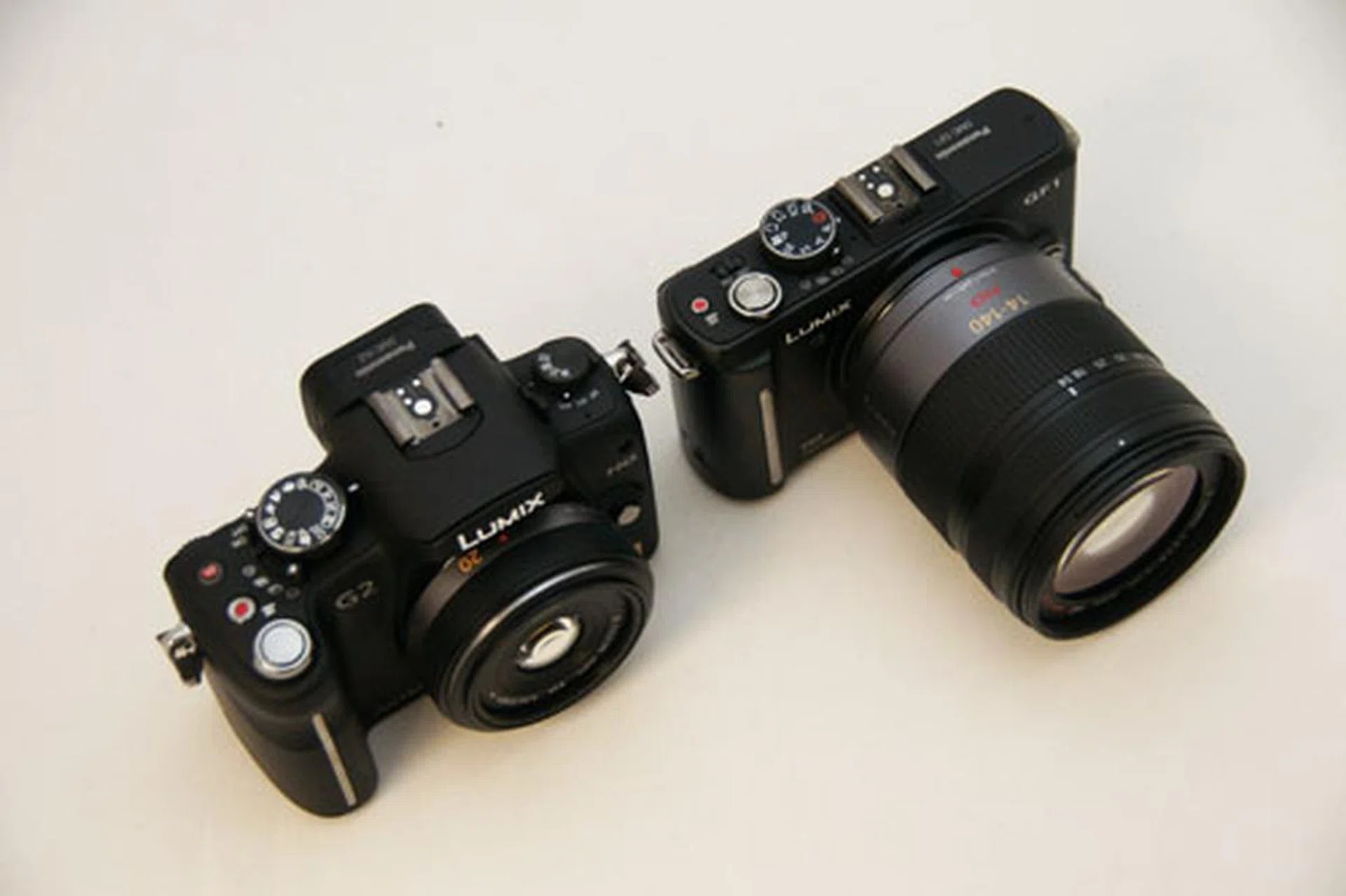 Size is relative to the lens. In this case, the G2 with the 20mm pancake (left) isn't that much bigger than the GF1 with the 14-140mm (right).
